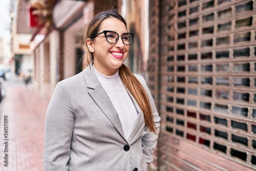 Young beautiful hispanic woman business worker smiling confident standing at street