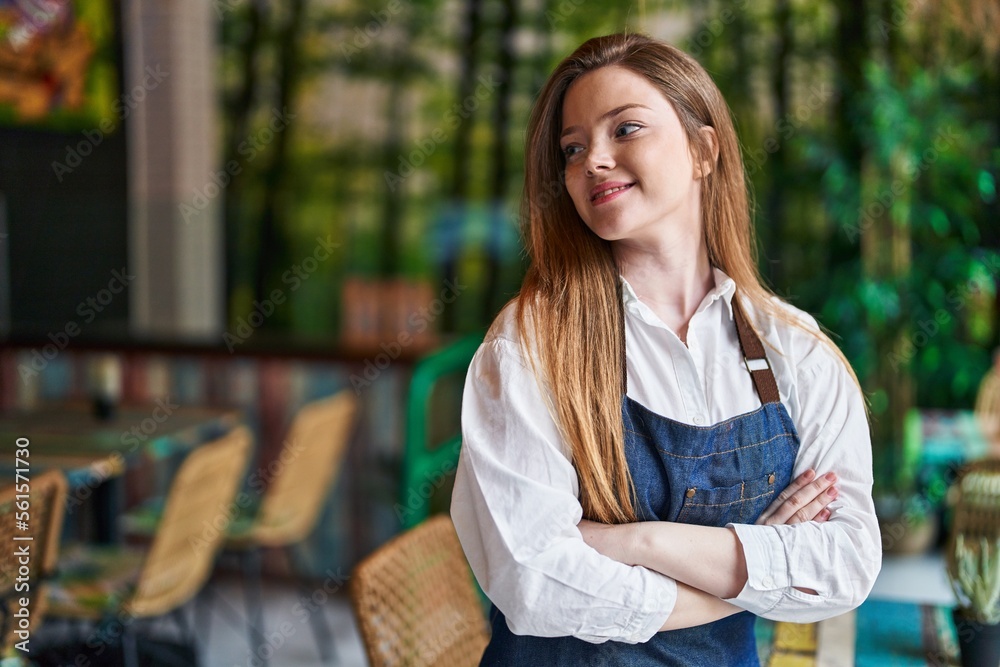Young caucasian woman waitress smiling confident standing with arms crossed gesture at restaurant Young caucasian woman waitress smiling confident standing with arms crossed gesture at restaurant