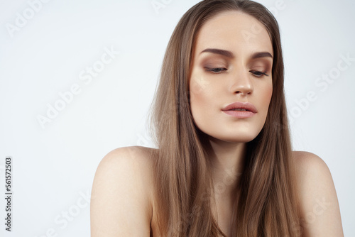 Beautiful caucasian girl with perfect straight wheat hair. Perfect skin, natural makeup