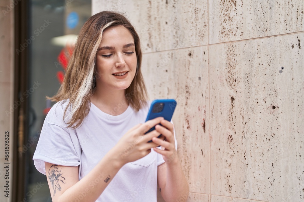 Young woman smiling confident using smartphone at street Young woman smiling confident using smartphone at street