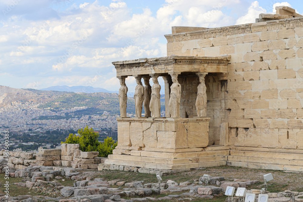 The Porch of the Maidens, the Erechtheion, Athenian Acropolis and panorama of Greek capital Athens. Cityscape, rooftops and mountains. Greece, Southern Europe, travel destination, ancient history.