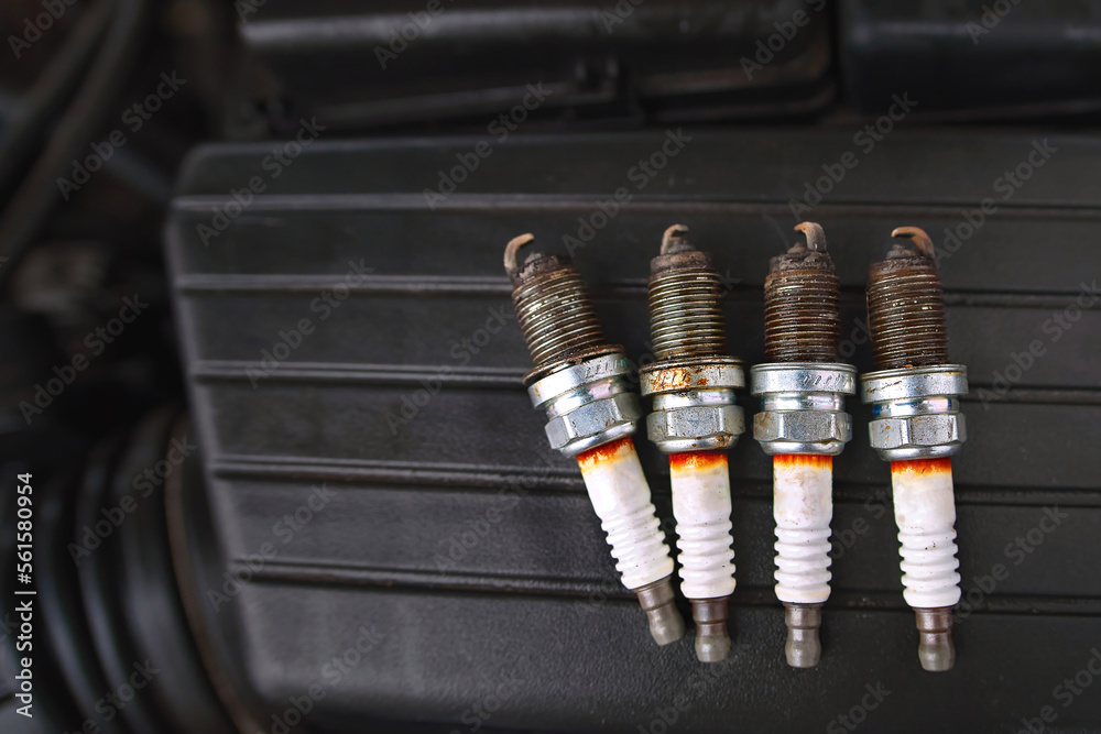 Spark plugs with worn electrodes. Used, burned four spark plugs