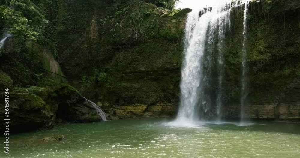 Beautiful waterfall in the rainforest. Ben-Ben Falls in the tropical mountain jungle. Negros, Philippines. Beautiful waterfall in the rainforest. Ben-Ben Falls in the tropical mountain jungle. Negros, Philippines.