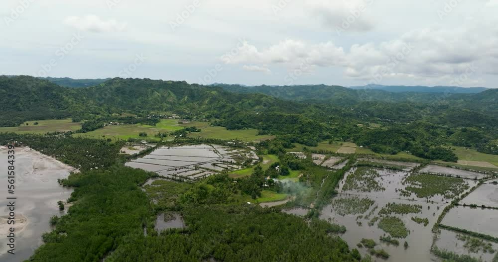 Aerial view of farmland and rice fields among the mountains. Negros, Philippines Aerial view of farmland and rice fields among the mountains. Negros, Philippines