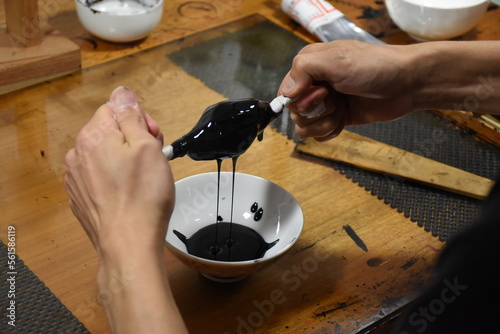 Filtration of Japanese lacquer urushi to remove dust particles - preparation of raw material to create luxurious and glossy traditional lacquerware