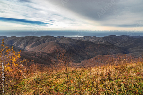 View from a height of 1000 m to the peaks of the North-Western Caucasus. Stunning view from the top of Mount Peus. Stunning view of the mountain landscape from a height. photo