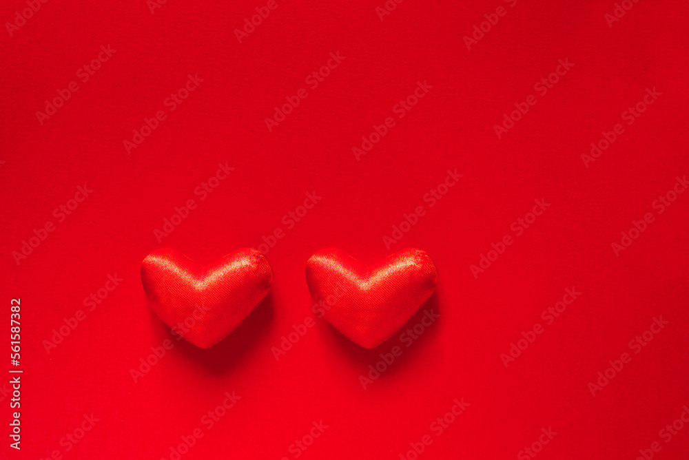 Valentine's day banner with two red hearts on a red background with space for text. love and happiness.	