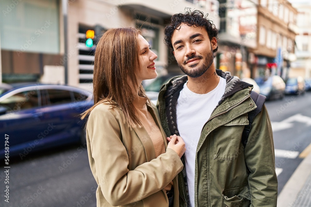 Man and woman smiling confident hugging each other at street Man and woman smiling confident hugging each other at street