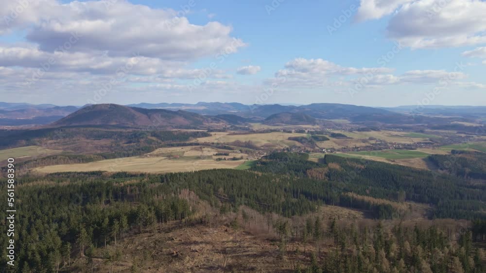 Aerial birds eye view of beautiful mountains covered with evergreen forest at sunny autumn day. Amazing nature landscape with mountains ranges and valleys Aerial birds eye view of beautiful mountains covered with evergreen forest at sunny autumn day. Amazing nature landscape with mountains ranges and valleys