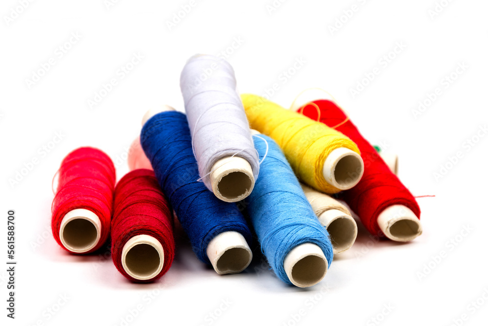 group of sewing spools isolated on white background with real shadows