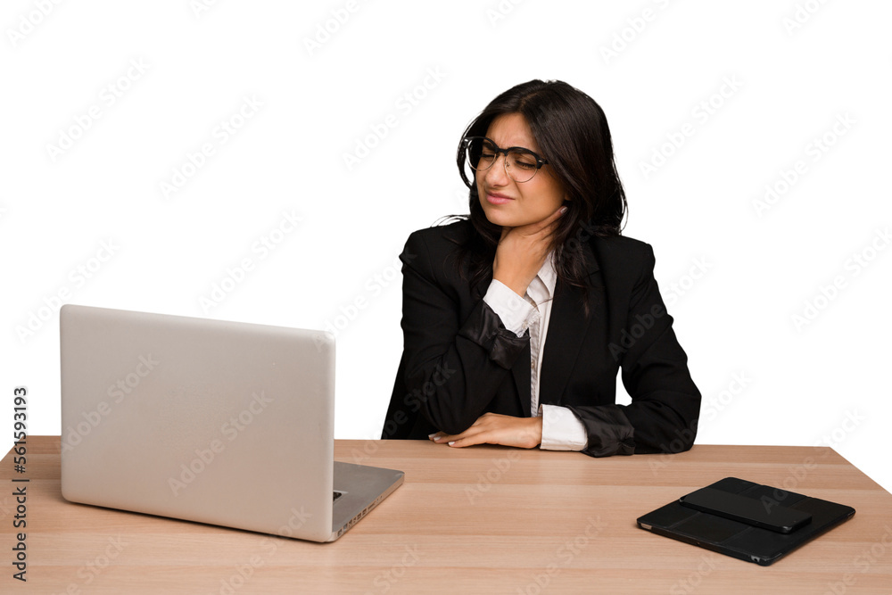 Young indian woman in a table with a laptop and tablet isolated suffers pain in throat due a virus or infection. Young indian woman in a table with a laptop and tablet isolated suffers pain in throat due a virus or infection.