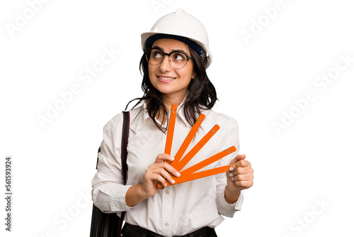 Young architect indian woman with helmet and holding a meter cut out isolated