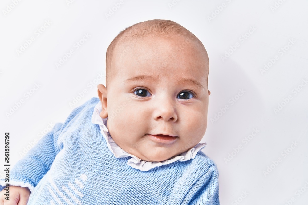 Adorable baby smiling confident over white isolated background