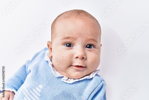 Adorable baby smiling confident over white isolated background