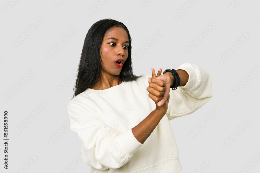 Young Indian woman wearing a hand watch isolated on white background Young Indian woman wearing a hand watch isolated on white background