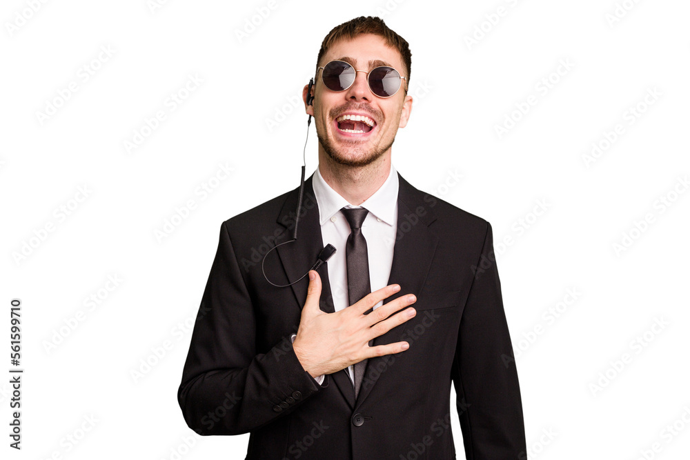 Security bodyguard man wearing a suit isolated cut out laughs out loudly keeping hand on chest. Security bodyguard man wearing a suit isolated cut out laughs out loudly keeping hand on chest.