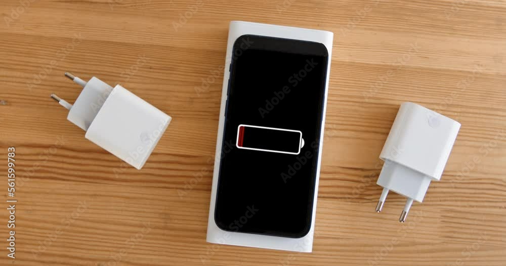 Wireless charging of a smartphone from a portable battery, wires are no longer needed, new energy technologies, phone charging from a powerbank. Wireless charging of a smartphone from a portable battery, wires are no longer needed, new energy technologies, phone charging from a powerbank.