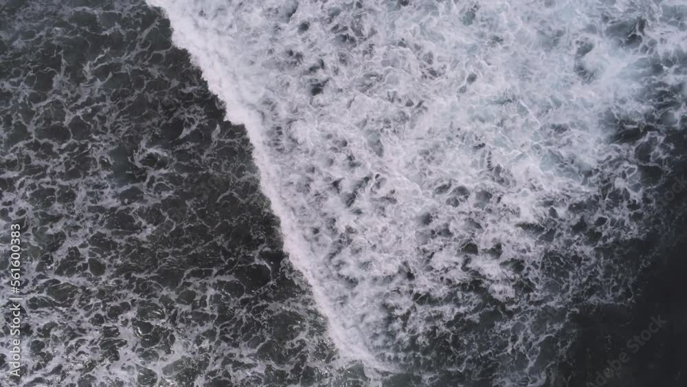 Wavy surface of sea or ocean. Big waves with white foam, splashing each other. Drone view, aerial shot. Chilling, relaxing atmosphere. Salty water, high tide concept Wavy surface of sea or ocean. Big waves with white foam, splashing each other. Drone view, aerial shot. Chilling, relaxing atmosphere. Salty water, high tide concept