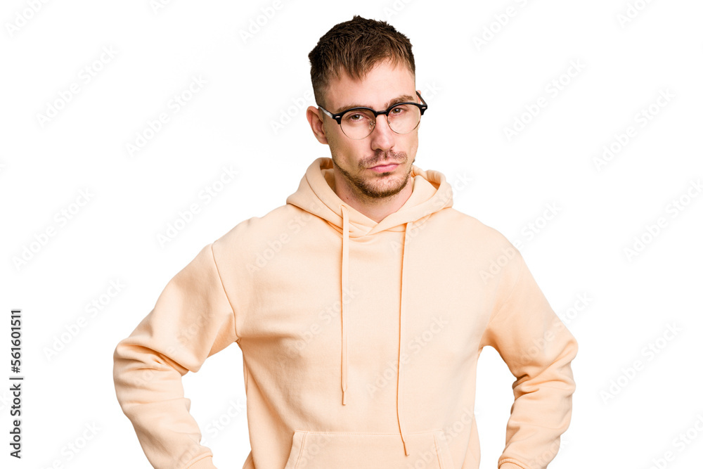 Fototapeta premium Young caucasian man cut out isolated frowning face in displeasure, keeps arms folded.