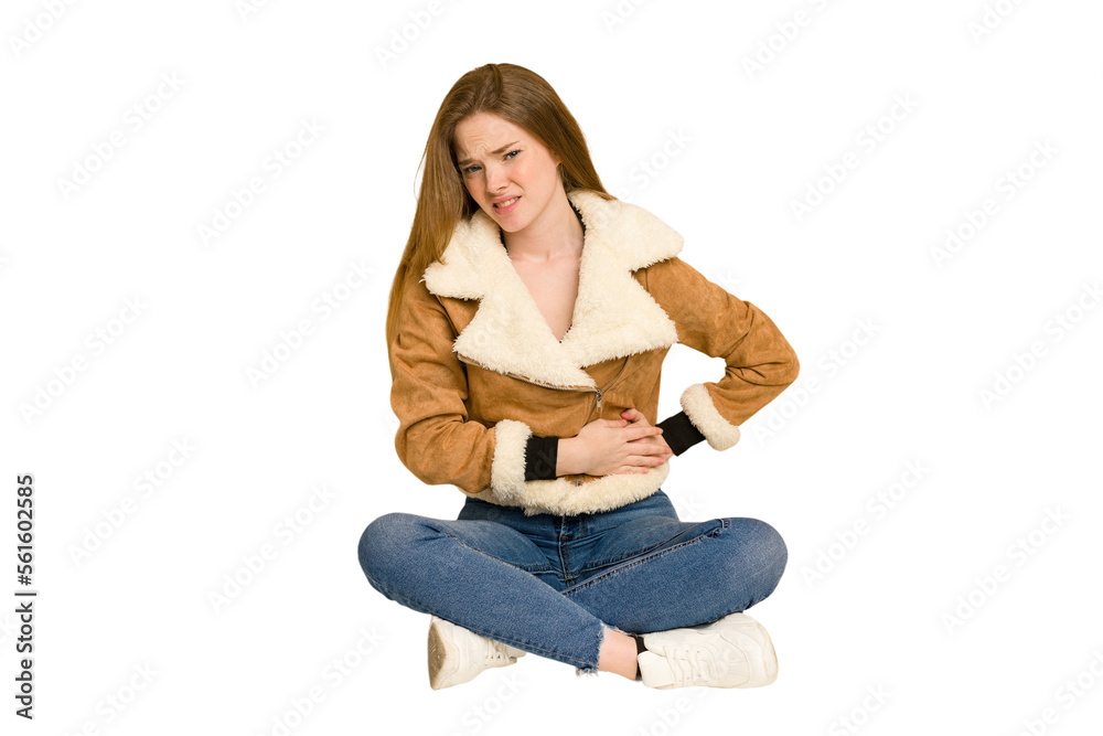 Young redhead woman sitting on the floor cut out isolated covering mouth with hands looking worried. Young redhead woman sitting on the floor cut out isolated covering mouth with hands looking worried.