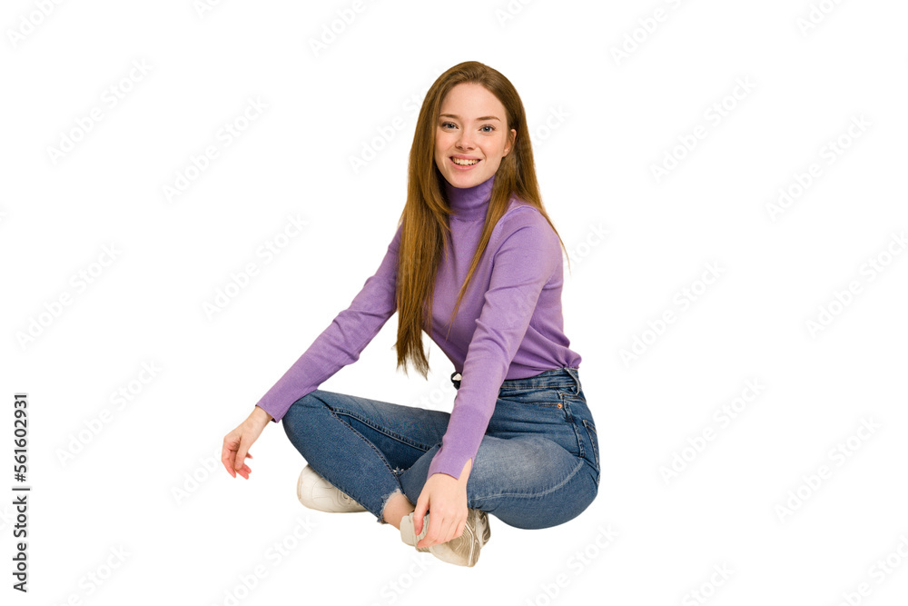 Young redhead woman sitting isolated cut out Young redhead woman sitting isolated cut out