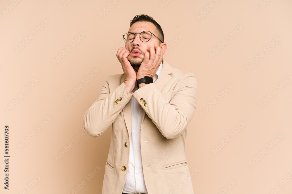 Adult latin business man cut out isolated crying, unhappy with something, agony and confusion concept. Adult latin business man cut out isolated crying, unhappy with something, agony and confusion concept.