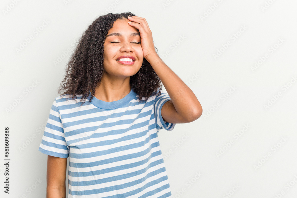 Young african american woman isolated on white background laughing happy, carefree, natural emotion. Young african american woman isolated on white background laughing happy, carefree, natural emotion.