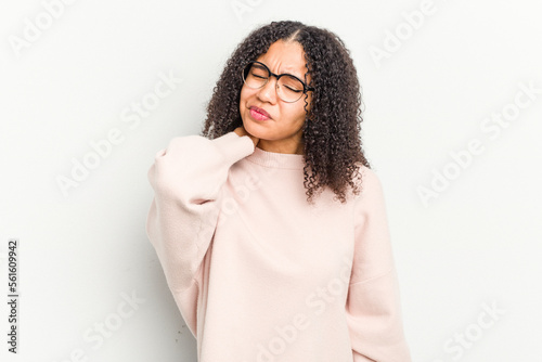 Young african american woman isolated on white background having a neck pain due to stress, massaging and touching it with hand.