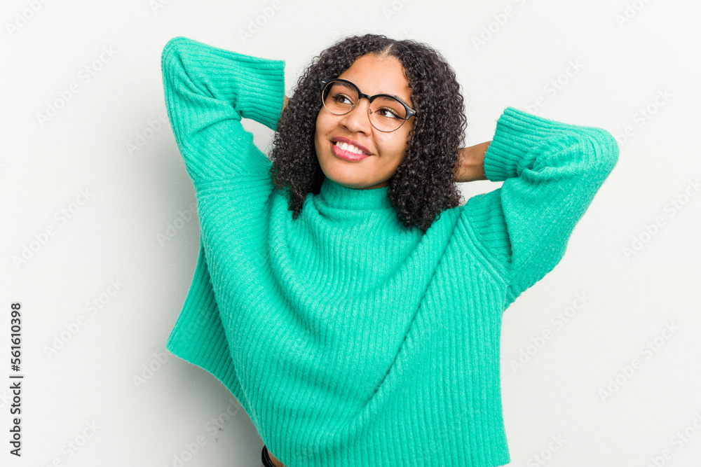 Young african american woman isolated on white background feeling confident, with hands behind the head. Young african american woman isolated on white background feeling confident, with hands behind the head.