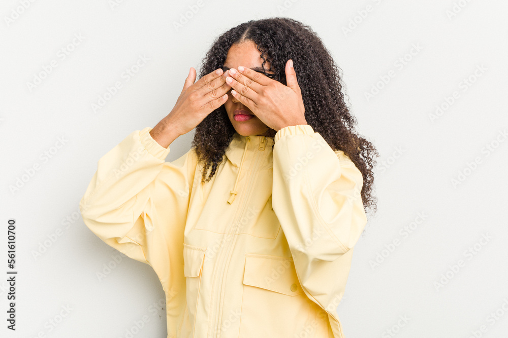Young african american woman isolated on white background afraid covering eyes with hands. Young african american woman isolated on white background afraid covering eyes with hands.