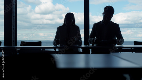 Wallpaper Mural Coworkers silhouettes working office at panorama window. Business team checking Torontodigital.ca