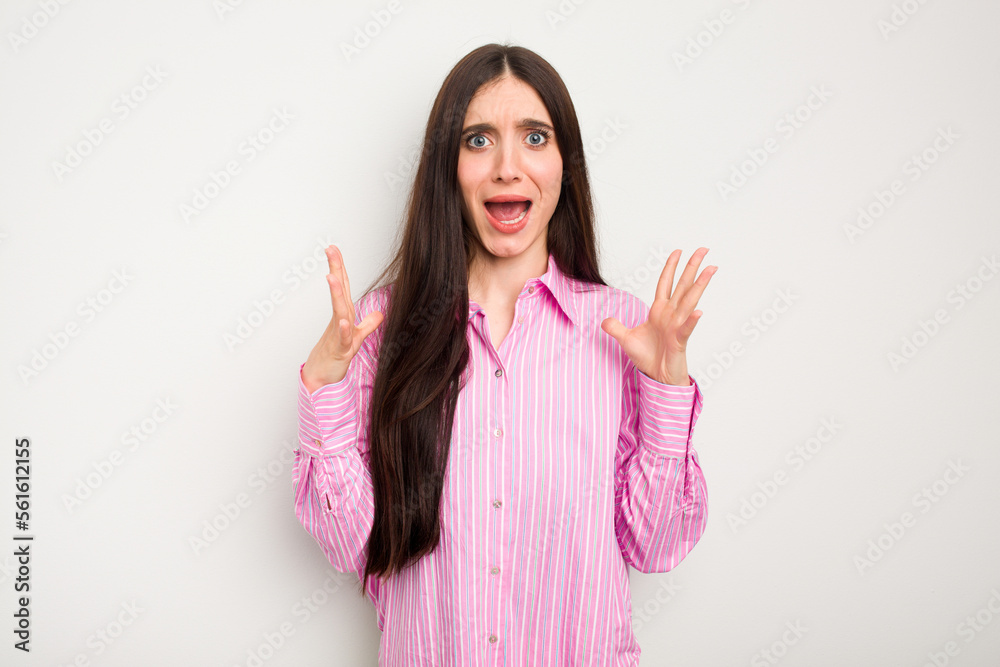 Young caucasian woman isolated on white background screaming to the sky, looking up, frustrated. Young caucasian woman isolated on white background screaming to the sky, looking up, frustrated.