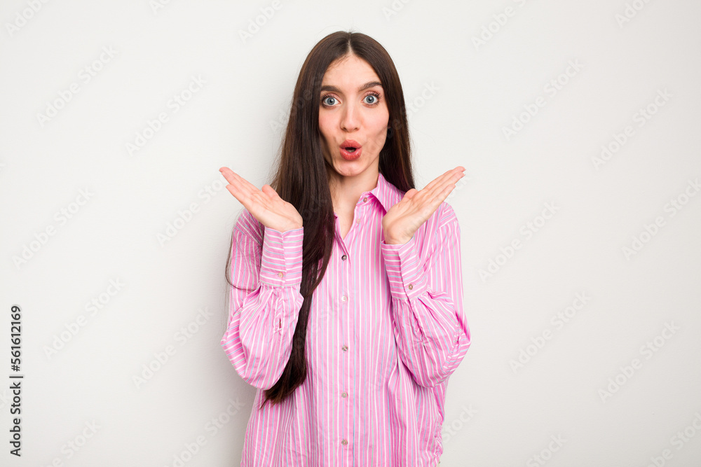 Young caucasian woman isolated on white background surprised and shocked. Young caucasian woman isolated on white background surprised and shocked.