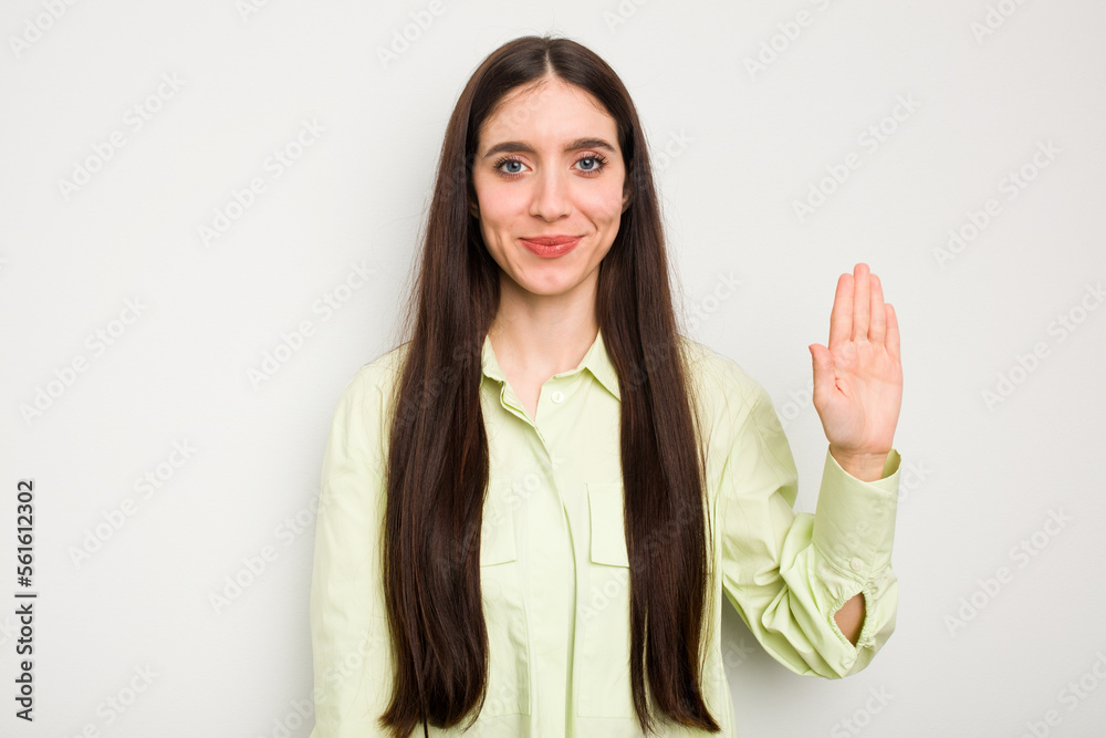 Young caucasian woman isolated on white background smiling cheerful showing number five with fingers. Young caucasian woman isolated on white background smiling cheerful showing number five with fingers.