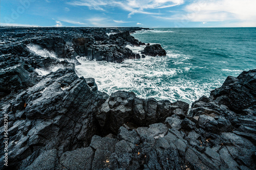 Brimketill lava rock pool - natural pool at the bottom of the cliffs, located on the Reykjanes Peninsula, west of the Grindavik, Iceland. photo