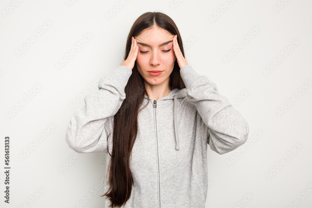 Young caucasian woman isolated on white background touching temples and having headache. Young caucasian woman isolated on white background touching temples and having headache.