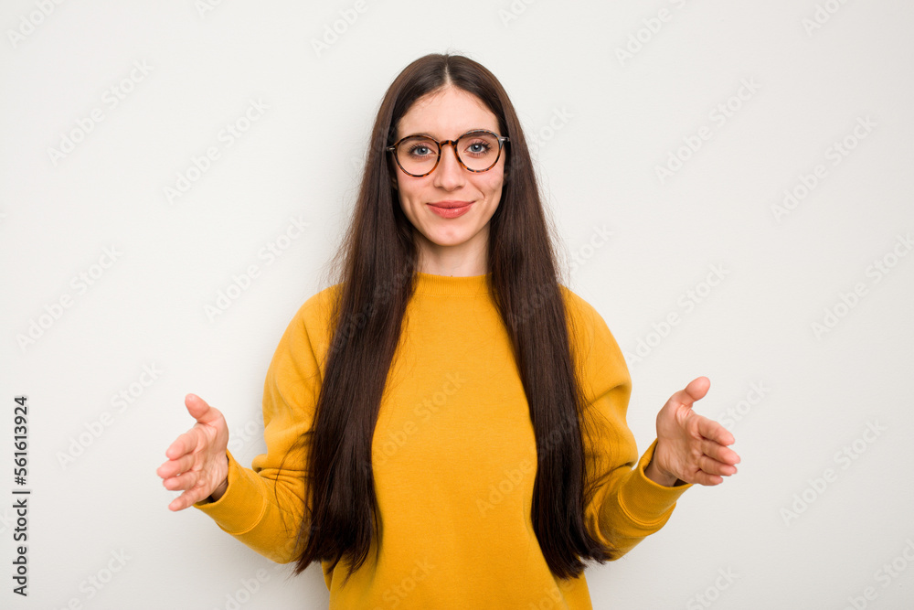 Young caucasian woman isolated on white background holding something with both hands, product presentation. Young caucasian woman isolated on white background holding something with both hands, product presentation.