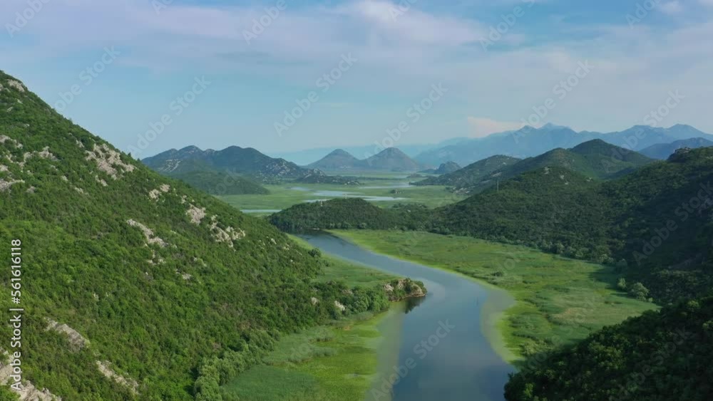 Aerial view of Rijeka Crnojevica - beautiful river between mountains flowing into Skadar Lake, Montenegro, 4k Aerial view of Rijeka Crnojevica - beautiful river between mountains flowing into Skadar Lake, Montenegro, 4k