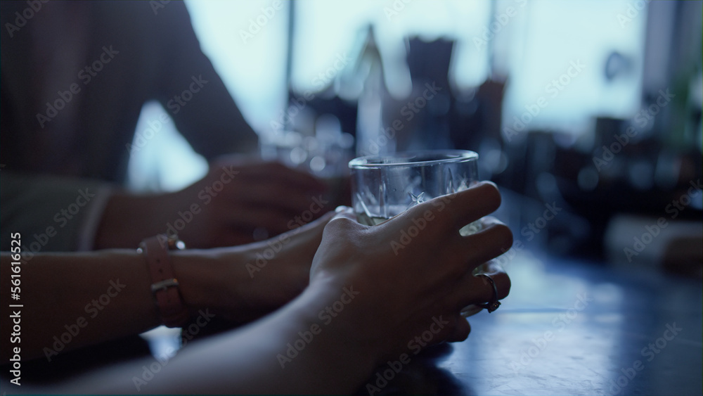 Couple hands drinking gin tonic in bar closeup. Unknown man woman dating in cafe Couple hands drinking gin tonic in bar closeup. Unknown man woman dating in cafe