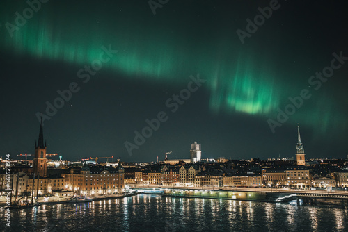 northern lights over the city photo
