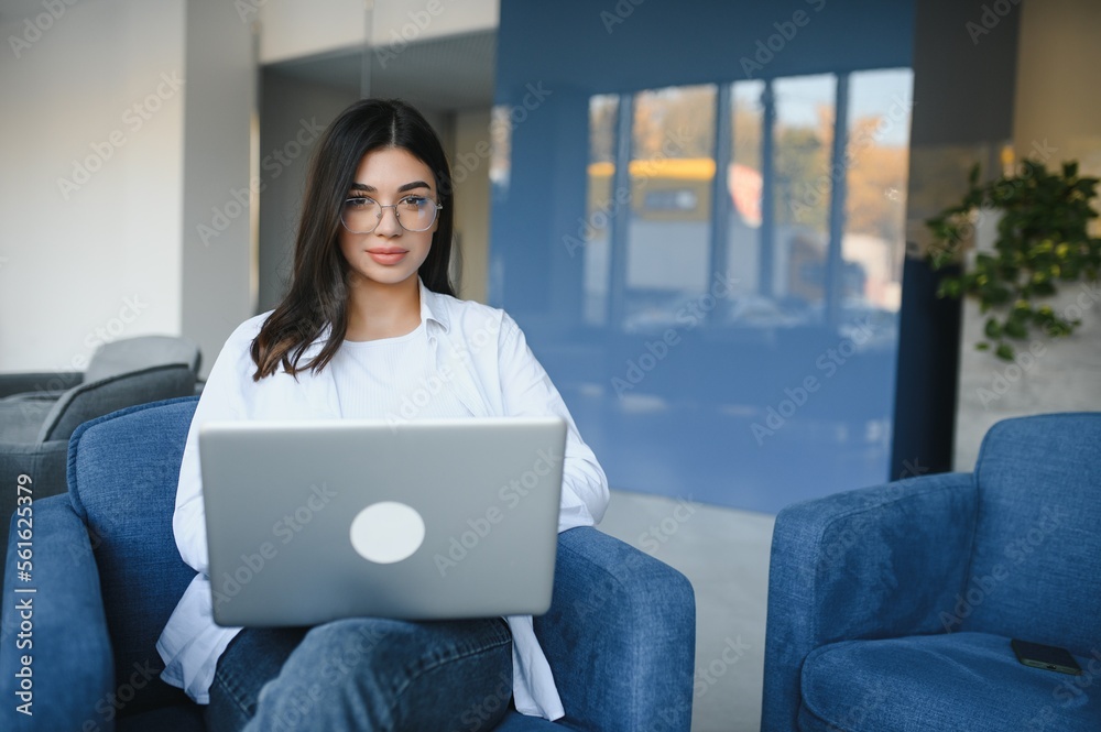 Beautiful Caucasian woman dreaming about something while sitting with portable net-book in modern cafe bar, young charming female freelancer thinking about new ideas during work on laptop computer Beautiful Caucasian woman dreaming about something while sitting with portable net-book in modern cafe bar, young charming female freelancer thinking about new ideas during work on laptop computer
