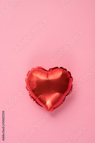 Pink background with red hearts balloons