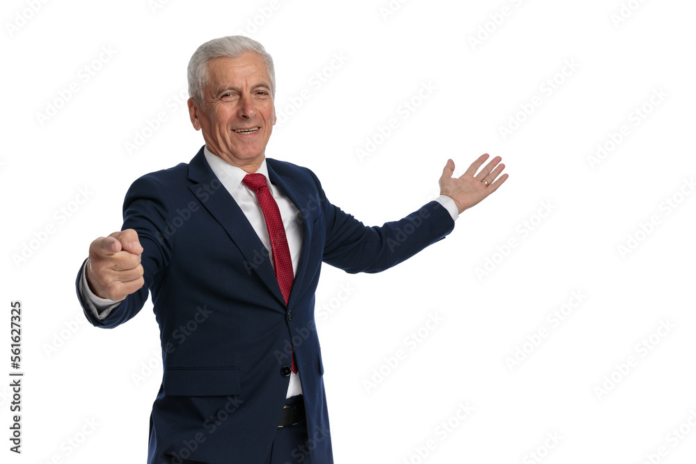 Old businessman pointing finger at the camera Old businessman pointing finger at the camera