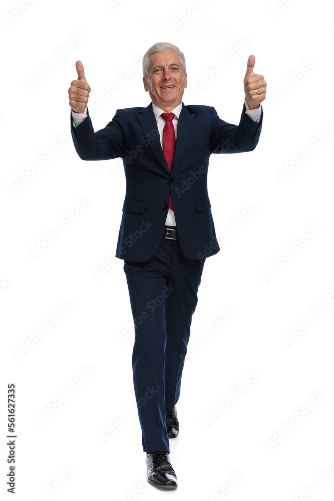 businessman walking towards the camera and giving a thumbs up businessman walking towards the camera and giving a thumbs up