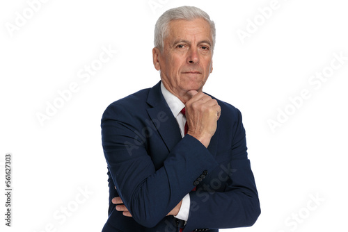 Businessman in his 60s scratching his chin