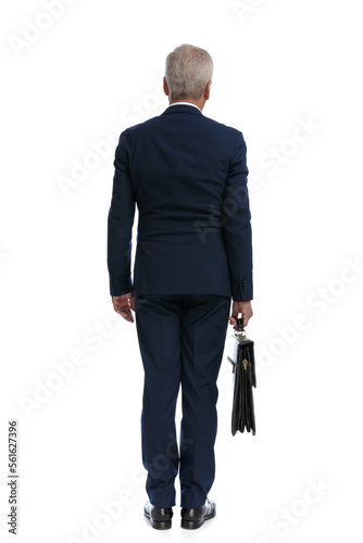 businessman turning his back at the camera
