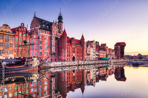 Illuminated Gdansk Old Town with Calm Motlawa River at Sunrise, Poland