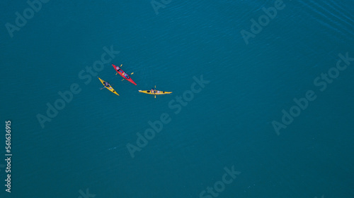 kayaks swimming in the ocean drone aerial 