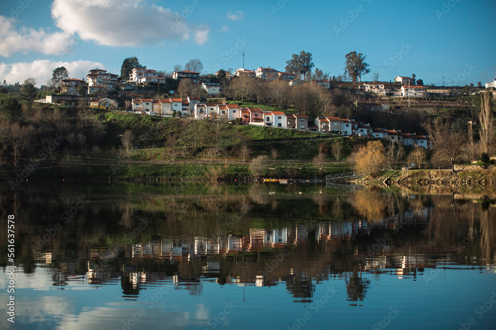Reflection of houses in the Douro River, Portugal.