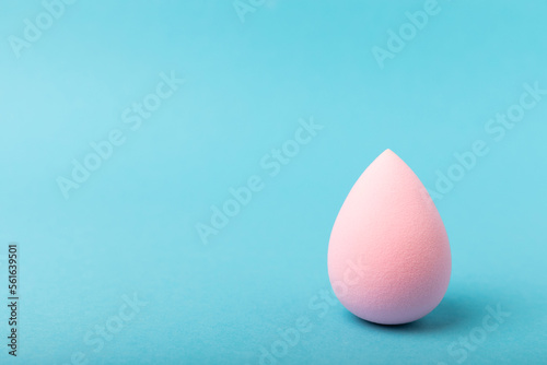 Beauty blender on blue background.Bright sponges for make-up cosmetics. Makeup products. Beauty concept. Place for text. Space for copy. Flat lay